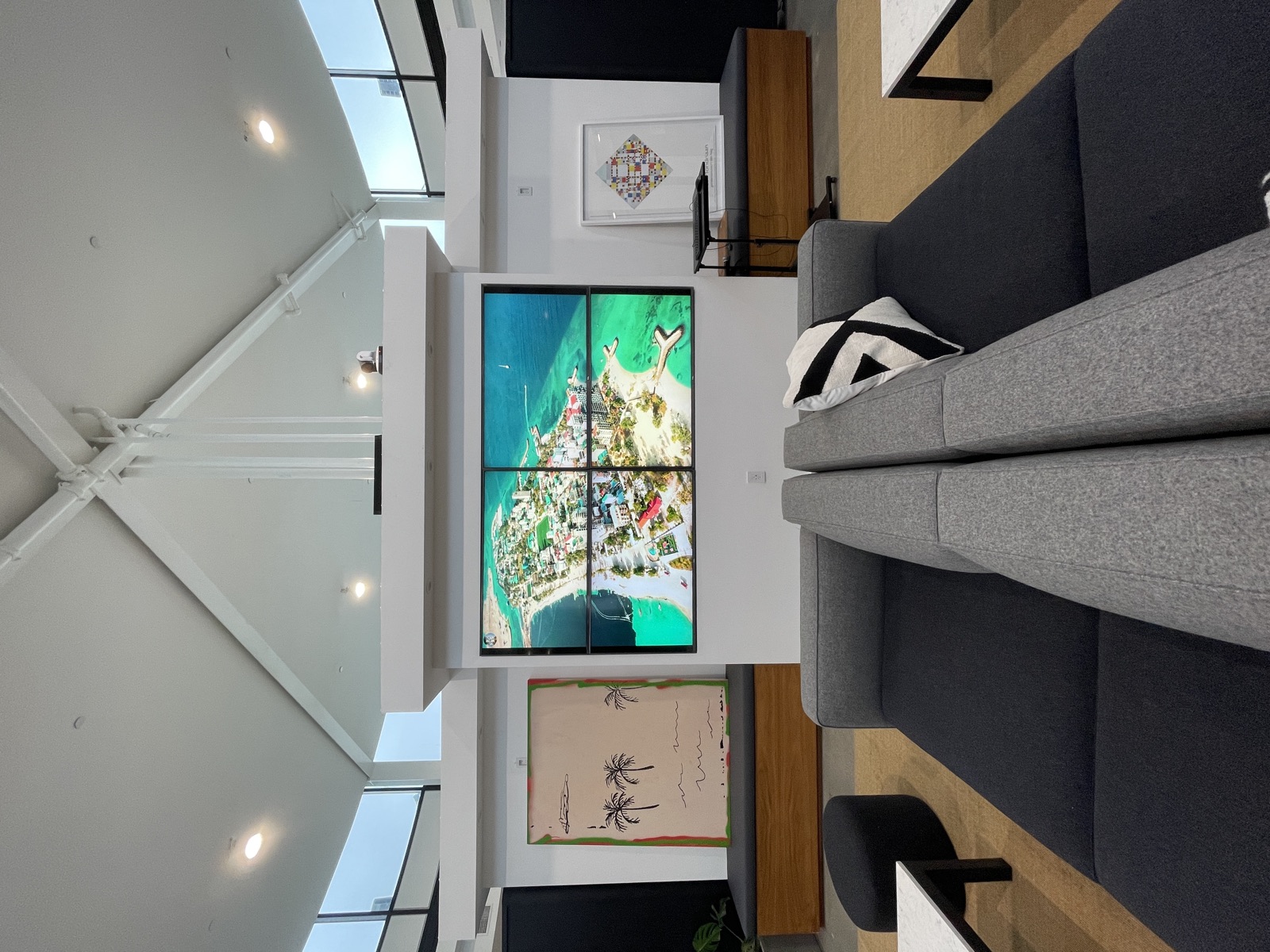 Lounge seating in front of the office video wall