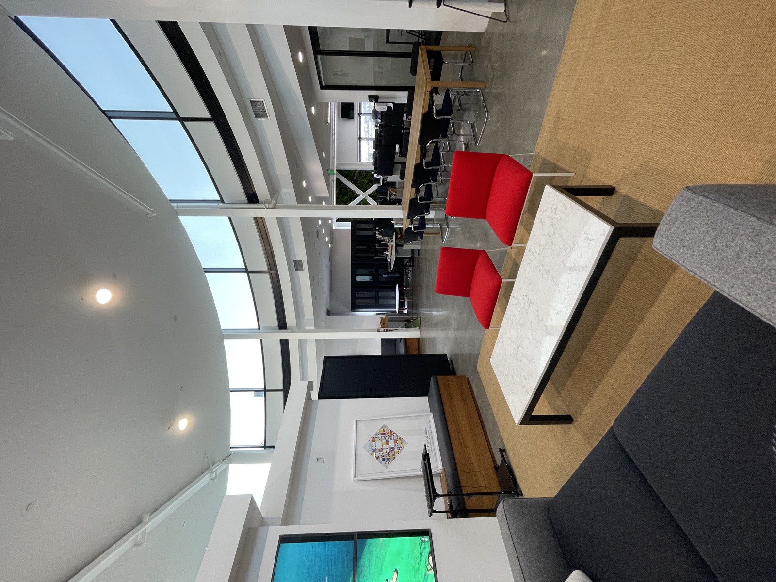 Red lounge chairs and marble coffee table
