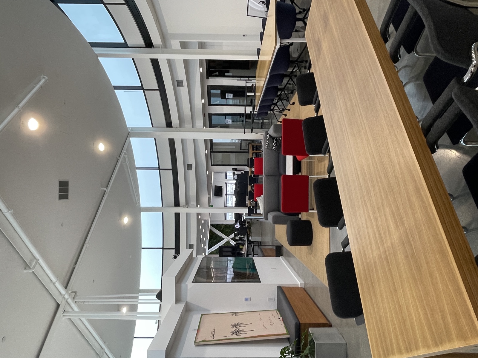 The Circle Real Estate rotunda office with panoramic windows and red chairs